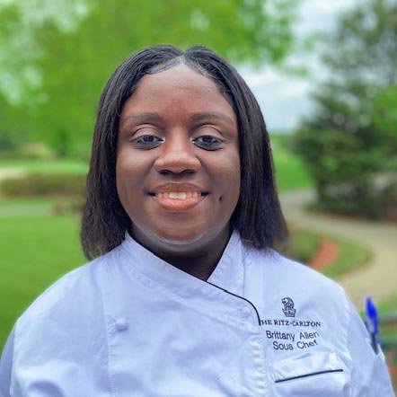 Ritz-Carlton chef Brittany Allen smiles for her headshot.