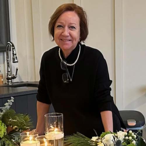 Portrait of Chef Cindy Loutini smilng into the camera.