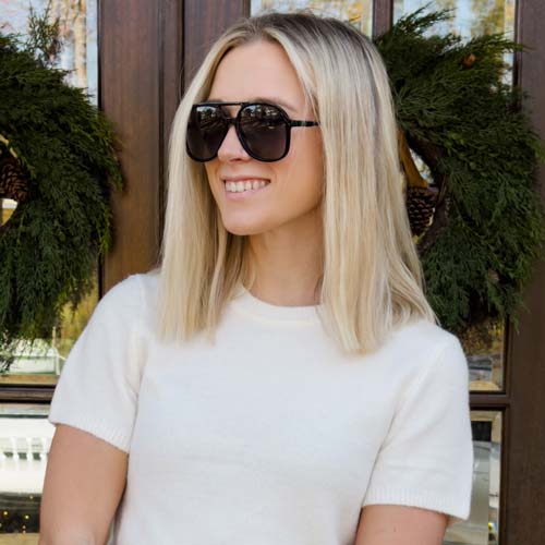 Photo of Grace Carticofe, baker and owner of Gracefully Baked, smiling and wearing sunglasses.