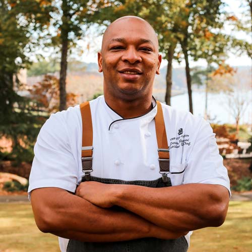A portrait of Executive Chef Dennis Vanterpool with Lake Oconee in the background.