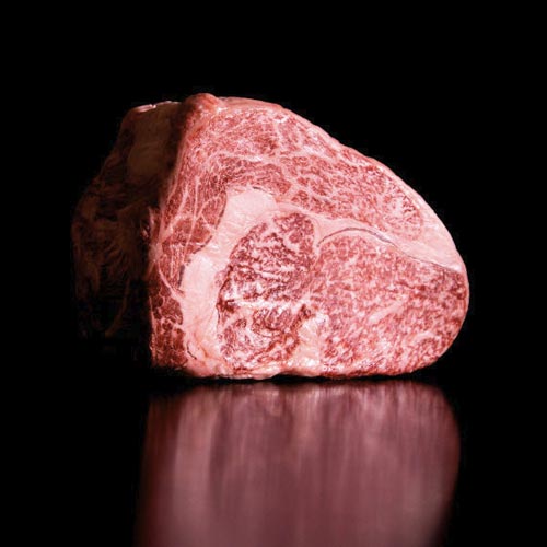 Photo of raw, marbled Sakura Wagyu Beef